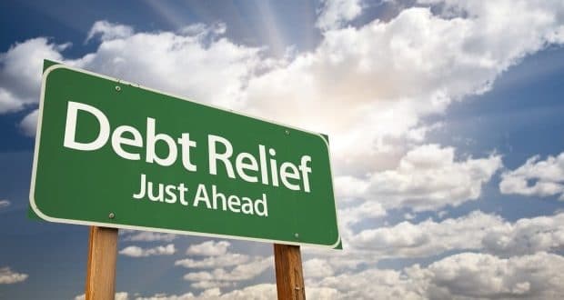 how to stay focused when paying off debts- debt relief signpost