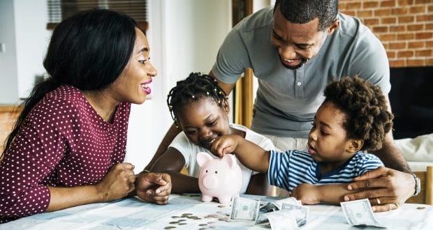 merging finances in a blended family- A family making financial plans