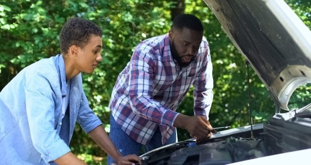 teaching your teen auto maintenance- a dad teaching his teen son auto maintenance