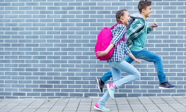 Trendy back to school outfits- a boy and a girl dressed for a school day