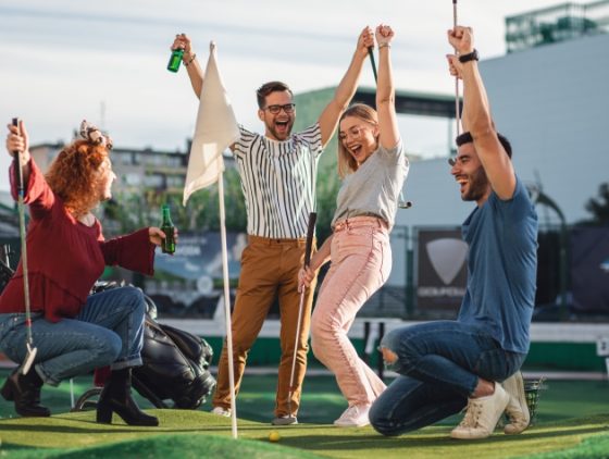 Fun Outdoor Things To Do On The Weekend - Friends Enjoying a Game of Mini Golf