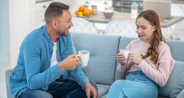 Tips on how to talk to your kids-a dad having a chit-chat with his daughter