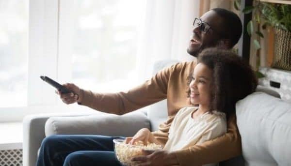 Healthy TV time for kids-dad and daughter watching a TV show