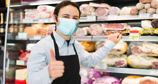 Grocery store workers- Grocery store clerk wearing mask