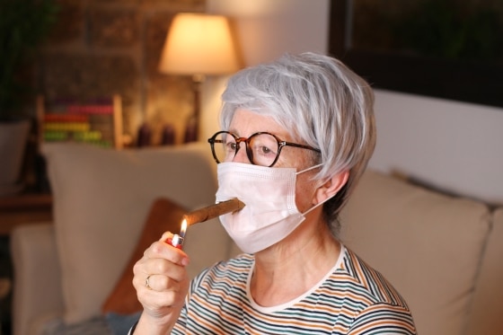 Senior woman wearing mask in quarantine