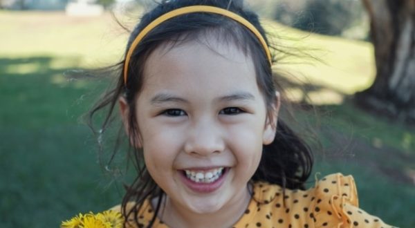Underbite teeth in children-A smiling girl with underbite teeth