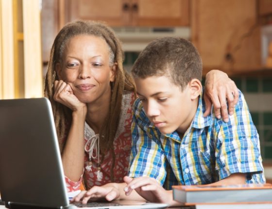 How to convert part of your home for learning- A mom helping her son with homeschooling