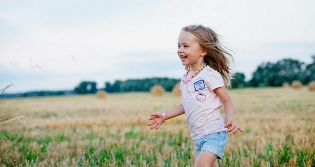 Importance of physical activity in children-A girl running in the field