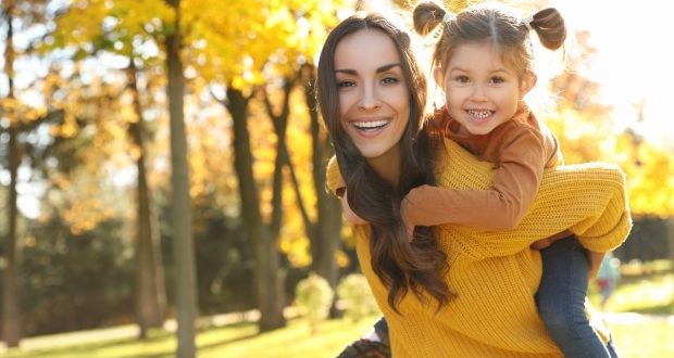 Things you should never say to a stepmom-A stepmom carrying her stepdaughter on her back