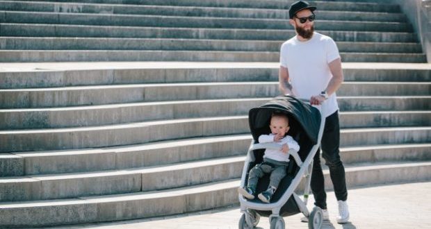 Stroller safety tips- a dad with a baby in a stroller