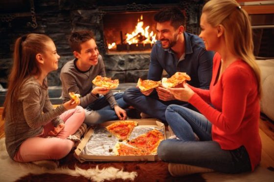 Activities to strengthen the blended family bond-A family enjoying pizza