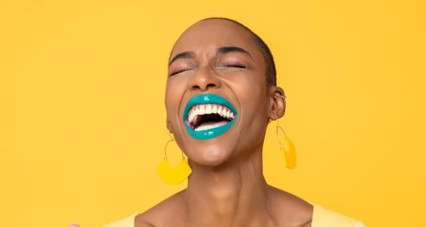 World Laughter Day- A woman laughing joyfully