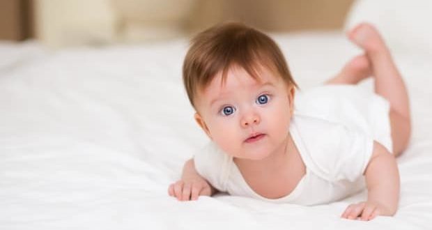 Why you should document your baby's milestone - A baby on a bed