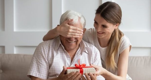 Gift ideas for stepdads - A stepdad getting a surprise gift