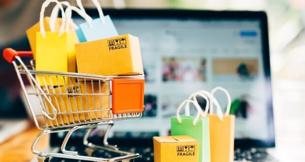 Essential tips for online shopping in 2023 - A cart of shopping bags