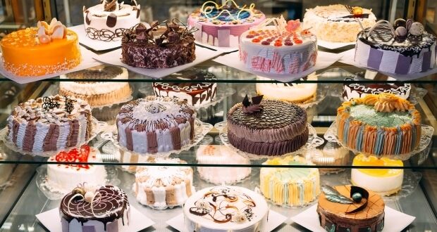 Cake display fridges - A variety of delicious looking cakes displayed in a cake fridge.