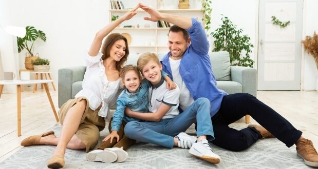 How to protect your family with family insurance- A happy couple with two children