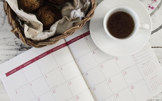 Family problems- Open calendar next to a cup of coffee