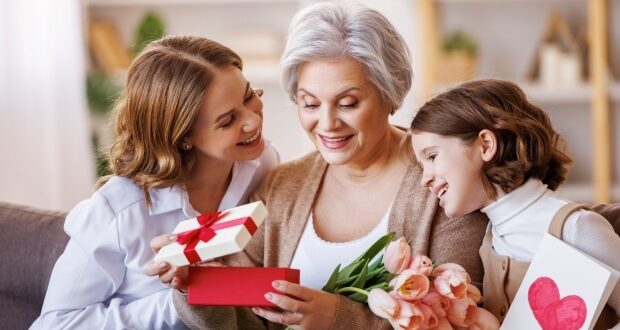 Lovely Mother's Day Gifts Under $50- Three generations of women opening gifts.