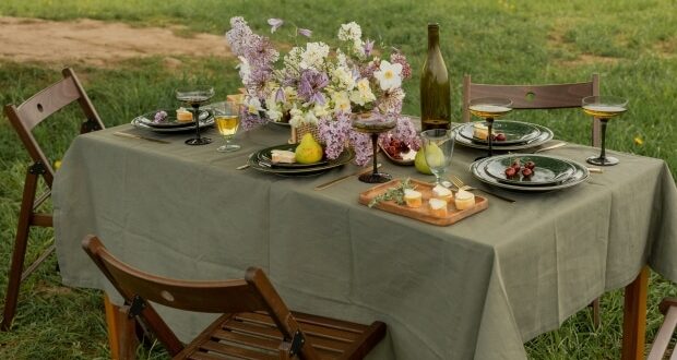 National Picnic Day- A table with flowers and fruits in the outdoors