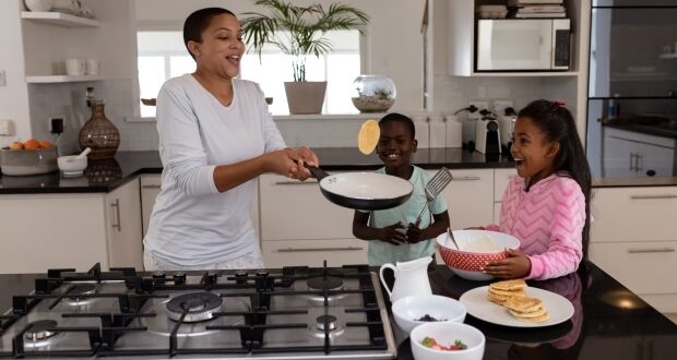 Gas Stove Safety- A mom and kids making pancakes over a gas stove