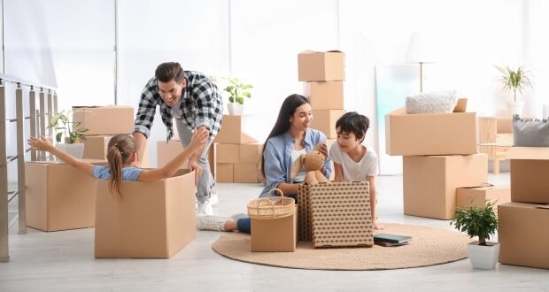 Dad Hacks To Ease Moving Your Family- A family moving into a new home