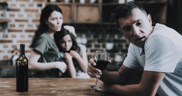 Healing Stepdad-Stepchild Relationships After Alcohol Addiction-Man drinking in front of wife and stepchild