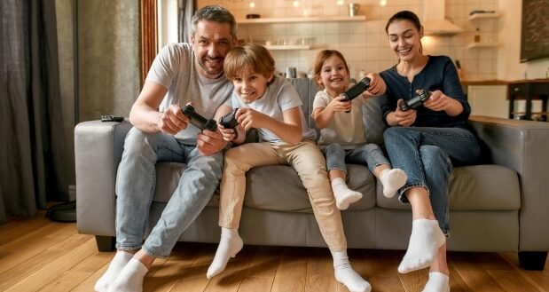 A Guide To Family Video Gaming - A family enjoying video game