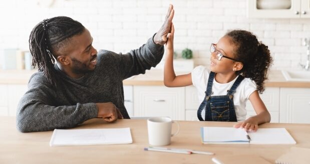 Navigating The Role Of A Stepdad -Stepdad helping stepdaughter with homework