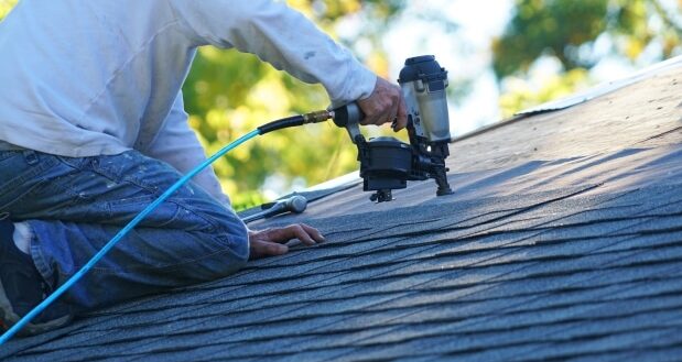 Roof repairs - A man on the roof
