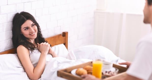 Biblical Guidance for Husbands - Husband serving wife breakfast in bed.