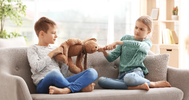 how to manage sibling rivalry in blended families -siblings having an argument