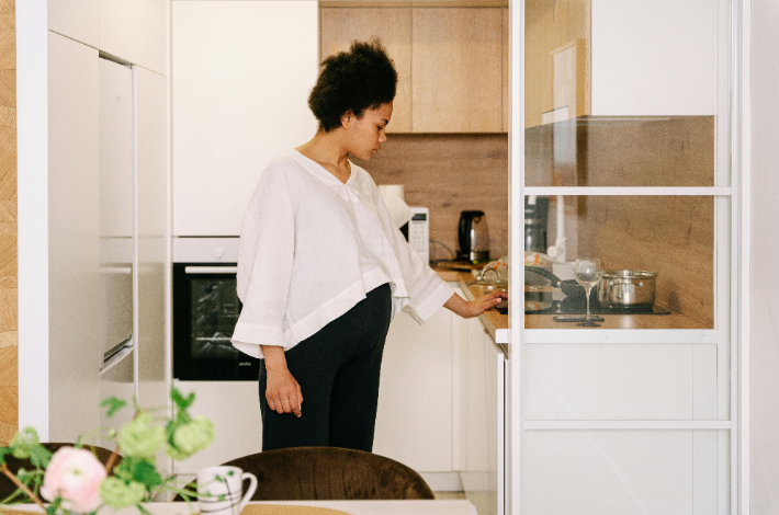 Portable Electric Induction Cooktops - A woman in the kitchen