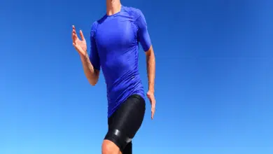 Sport runner male athlete running in compression sportswear clothing