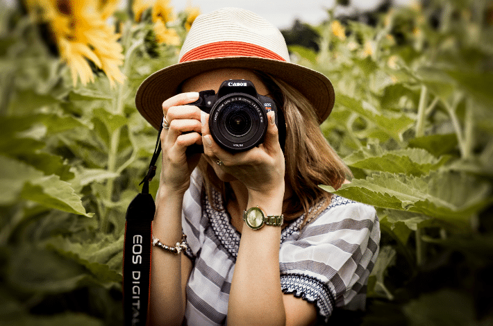 Nature Photography Day - A woman taking photos.