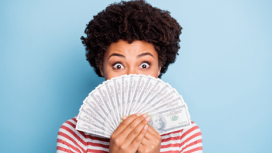 National Lottery Day - A woman holding out some dollar notes