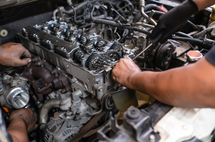 How To Care For Your Diesel Engine - A man working on an engine.