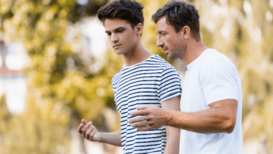 supporting teen stepchildren-stepdad speaking with teenager