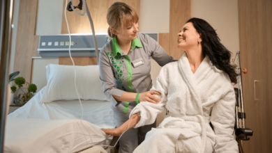 Patient transfer aids- a carer helping a patient into bed