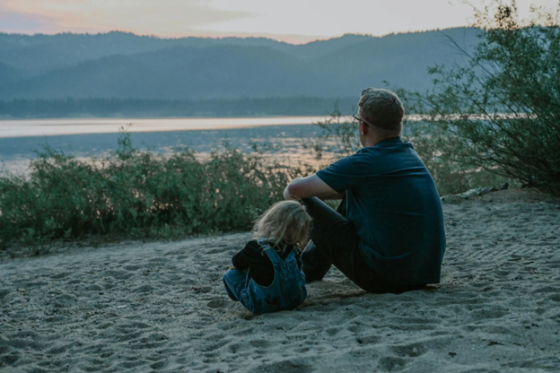 Stepdad sitting with child practicing grounding through sensory awareness