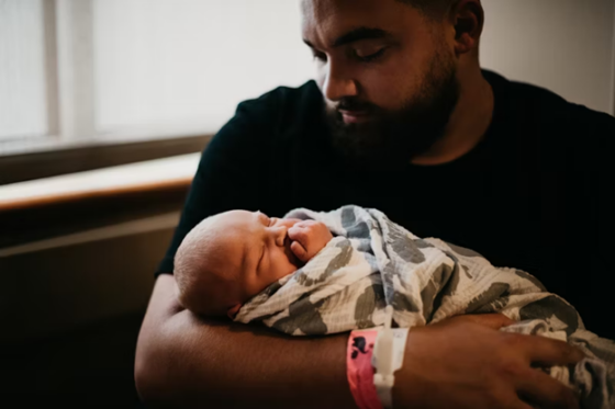 Man holding baby