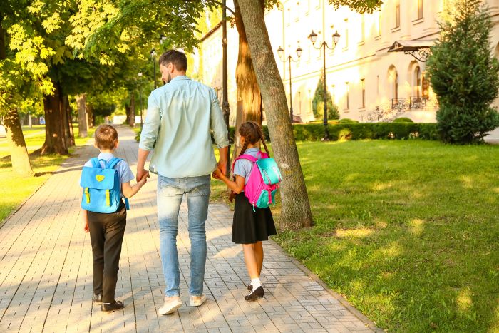 Stepdad parenting tips - Children going to school with their stepdad