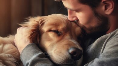 Man lovingly embraces his golden retriever, displaying a deep bond.