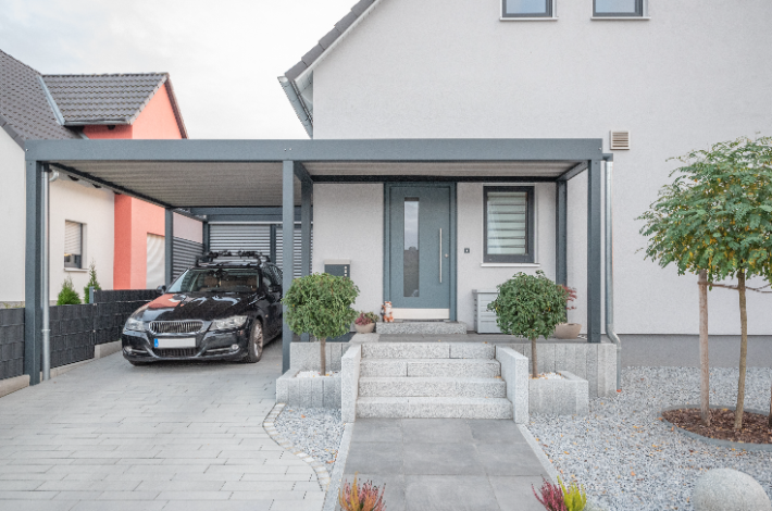 Choosing The Perfect Carport Design - Front view of a house with a carport.