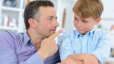 How stepdads can discipline with love - Man pointing finger at young stepchild