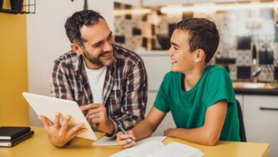 Homework help for stepkids-Stepdad helping his stepson with homework.