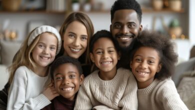 Mental Health in Blended Families- a happy family smiling into the camera