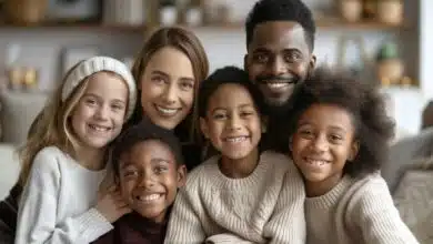Mental Health in Blended Families- a happy family smiling into the camera