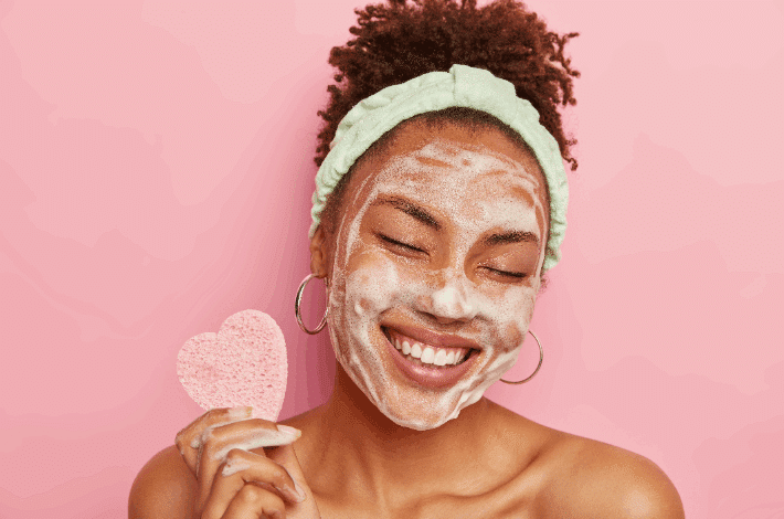 National Skincare Education Day - beautiful lady doing a facial skincare routine