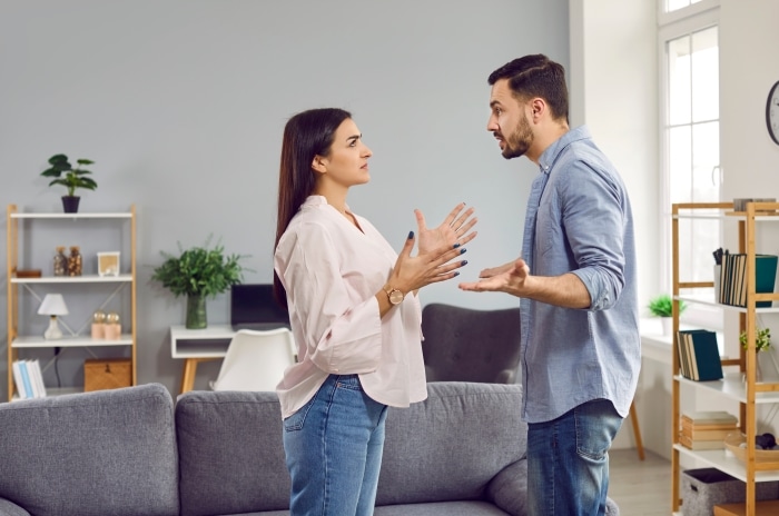 why stepfamilies fail-Emotional stressed young couple having argument at home.